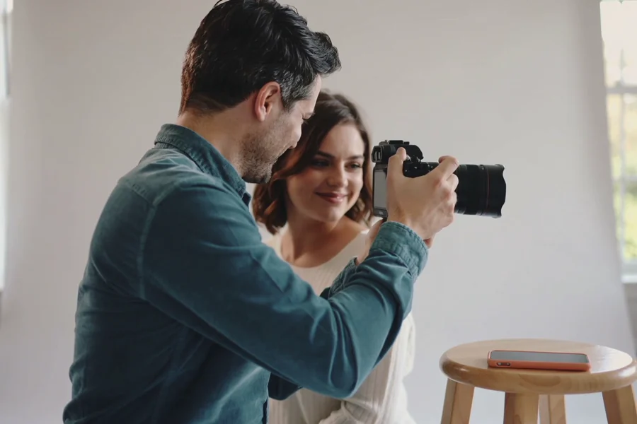 A photographer sharing a moment with a client, from the RevenuePack film